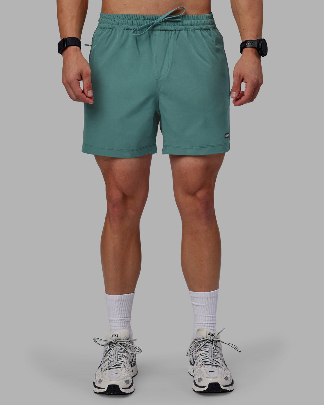 Man wearing Rep 5" Performance Shorts - Sage Bush - view 7