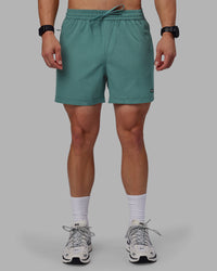 Man wearing Rep 5" Performance Shorts - Sage Bush | Thumbnail Index: 6