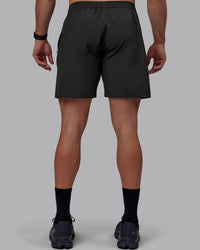 Man wearing Rep 7" Performance Shorts - Pirate Black | Thumbnail Index: 3