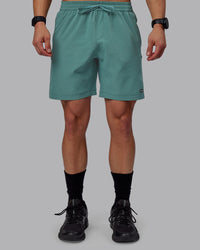 Man wearing Rep 7" Performance Shorts - Sage Bush | Thumbnail Index: 5