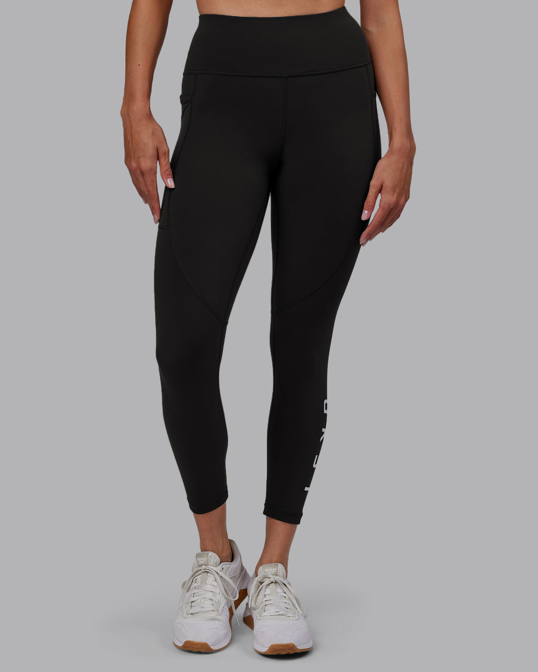 Woman wearing Rep Ultra High-Rise 7/8 Legging Pockets - Pirate Black-White | Model:Blaize | Size:S - view 4
