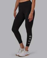 Woman wearing Rep Ultra High-Rise 7/8 Legging Pockets - Pirate Black-White | Model:Blaize | Size:S | Thumbnail Index: 1