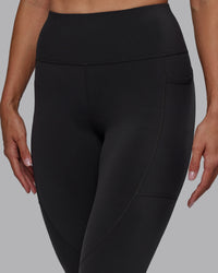 Woman wearing Rep Ultra High-Rise 7/8 Legging Pockets - Pirate Black-White | Model:Blaize | Size:S | Thumbnail Index: 4