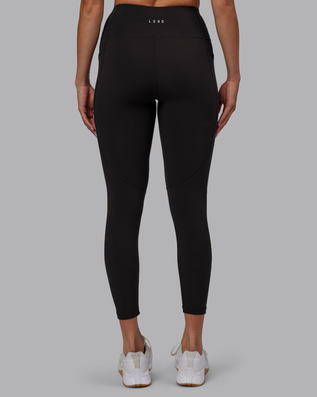 Woman wearing Rep Ultra High-Rise 7/8 Legging Pockets - Pirate Black-White | Model:Blaize | Size:S - view 6