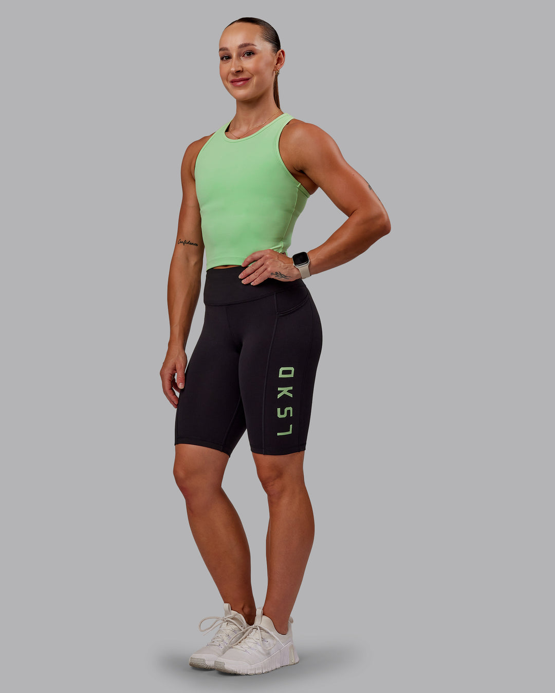 Woman wearing Rep Ultra High-Rise 9" Short Pockets - Black-Surreal Green | Model:Amber | Size:S - view 1