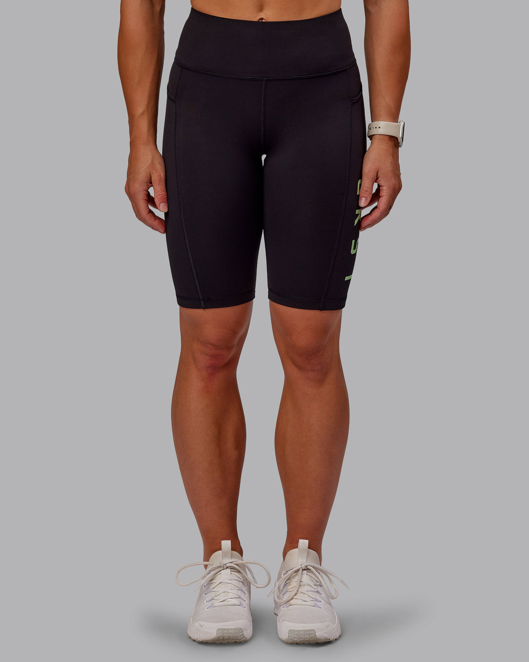 Woman wearing Rep Ultra High-Rise 9" Short Pockets - Black-Surreal Green | Model:Amber | Size:S - view 3