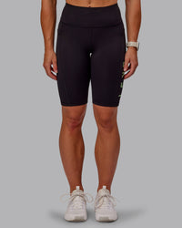 Woman wearing Rep Ultra High-Rise 9" Short Pockets - Black-Surreal Green | Model:Amber | Size:S | Thumbnail Index: 2