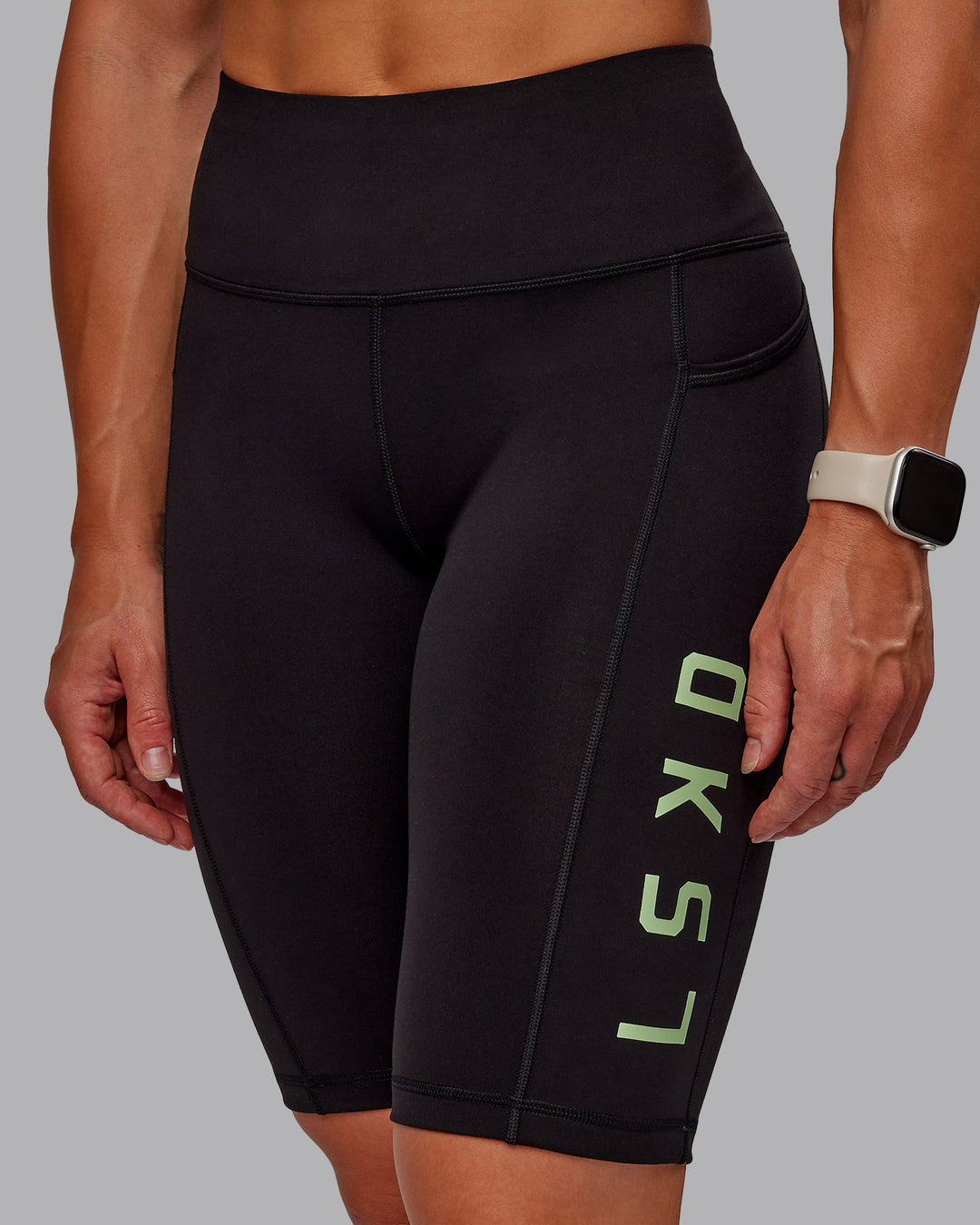 Woman wearing Rep Ultra High-Rise 9" Short Pockets - Black-Surreal Green | Model:Amber | Size:S - view 8