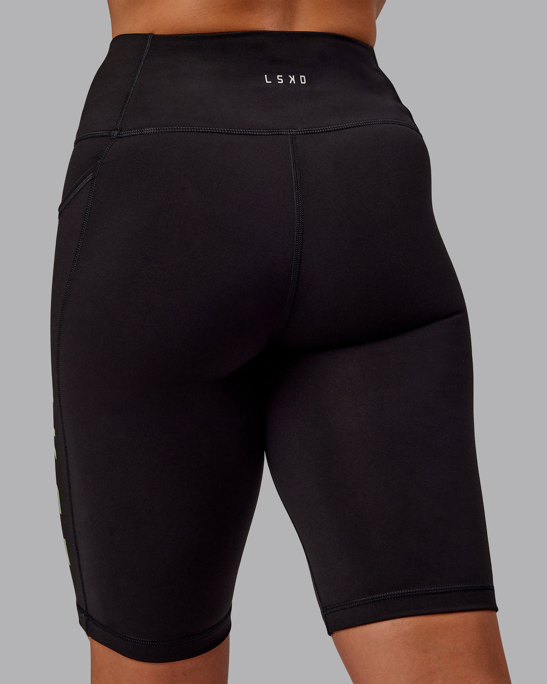 Woman wearing Rep Ultra High-Rise 9" Short Pockets - Black-Surreal Green | Model:Amber | Size:S - view 6