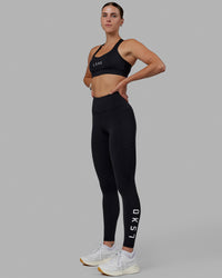 Woman wearing Rep Ultra High-Rise Full Length Legging Pockets - Black-White | Model:Shae | Size:S | Thumbnail Index: 8