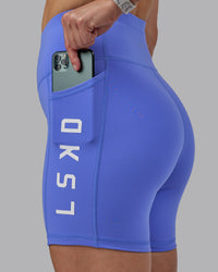 Woman wearing Rep Ultra High-Rise 6" Short Pockets - Baja Blue-White | Model:Lillie | Size:S | Thumbnail Index: 1