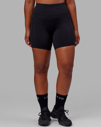 Woman wearing Rep Ultra High-Rise 6" Short Pockets - Black-Black | Model:Sierra | Size:L | Thumbnail Index: 5