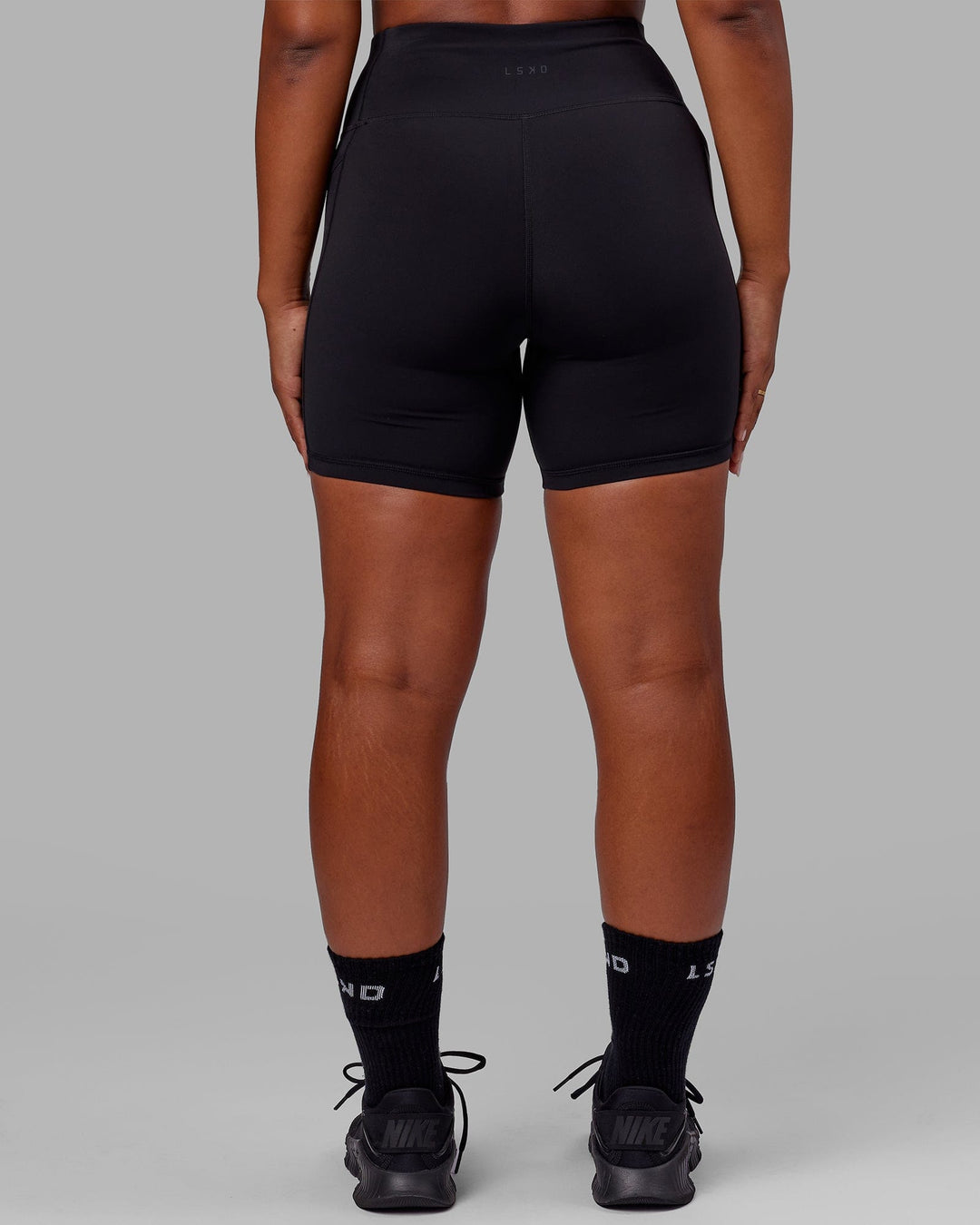 Woman wearing Rep Ultra High-Rise 6" Short Pockets - Black-Black | Model:Sierra | Size:L - view 4