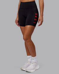 Woman wearing Rep Ultra High-Rise 6" Short Pockets - Black-Scarlet | Model:Demi | Size:S | Thumbnail Index: 2