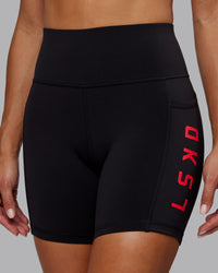 Woman wearing Rep Ultra High-Rise 6" Short Pockets - Black-Scarlet | Model:Demi | Size:S | Thumbnail Index: 6