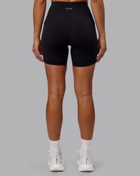 Woman wearing Rep Ultra High-Rise 6" Short Pockets - Black-Scarlet | Model:Demi | Size:S | Thumbnail Index: 3