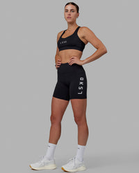 Woman wearing Rep Ultra High-Rise 6" Short Pockets - Black-White | Model:Shae | Size:S | Thumbnail Index: 5