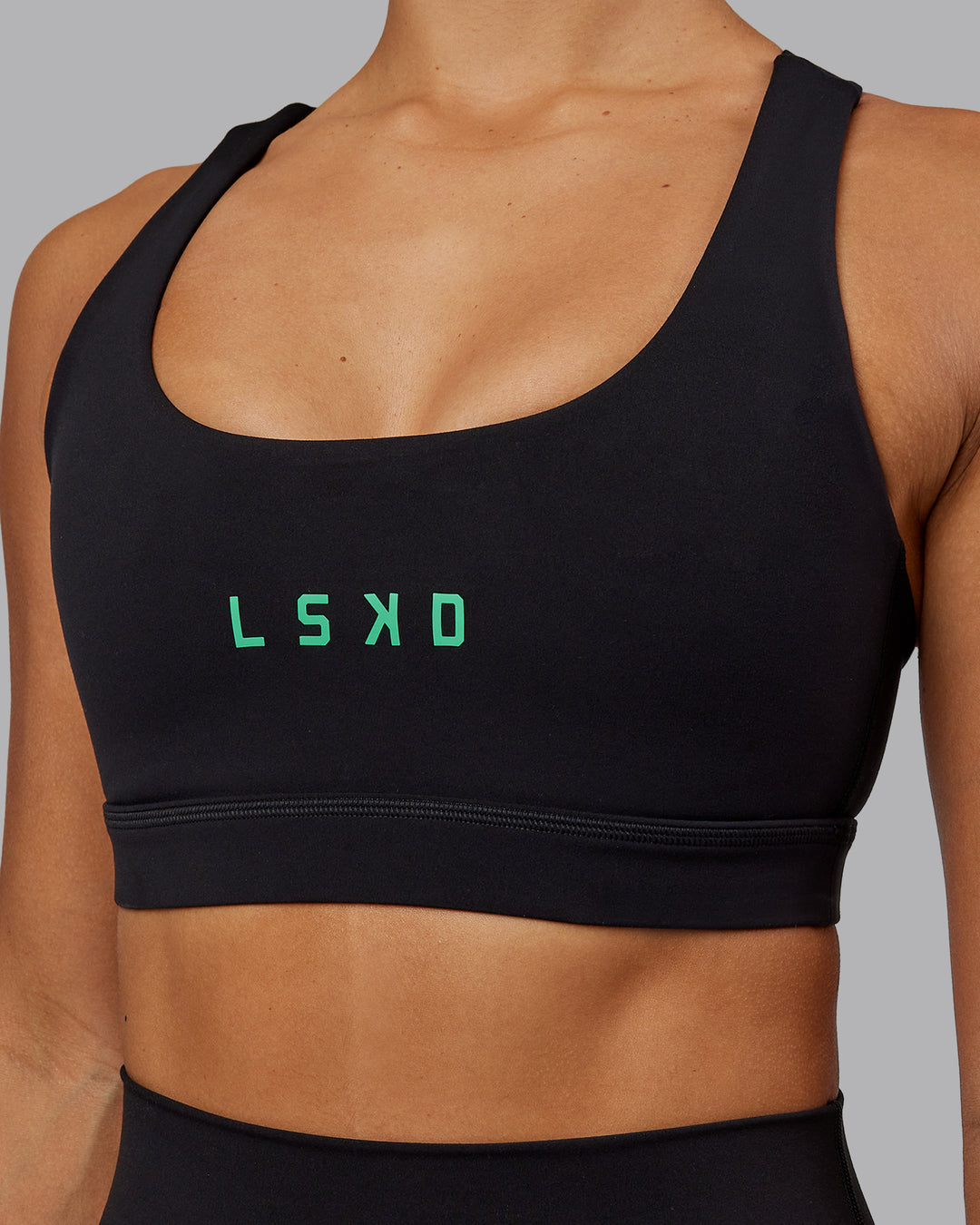 Woman wearing Rep Sports Bra - Black-Impact Green - view 4