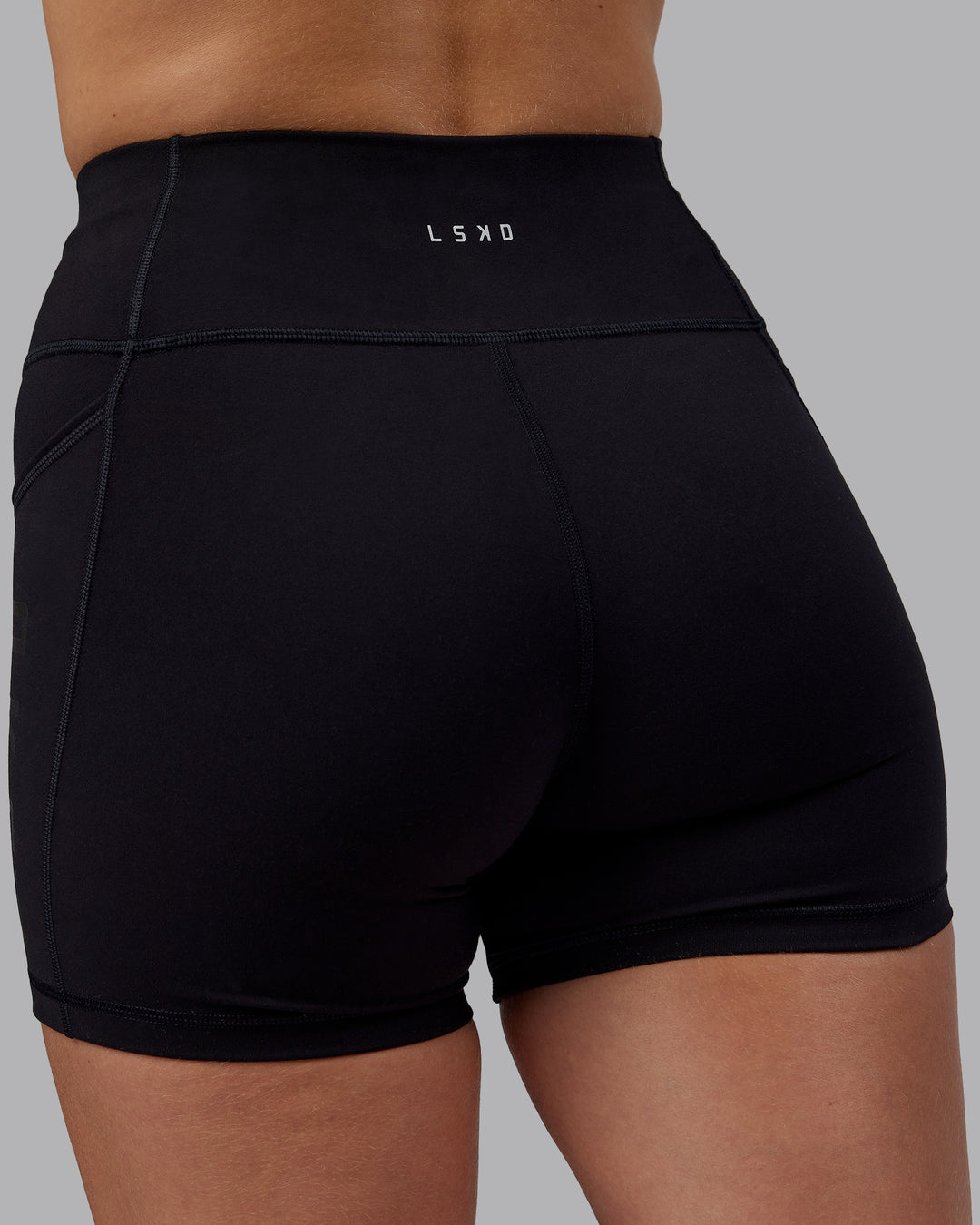 Woman wearing Rep Ultra High-Rise 4" Short Pockets - Black-Black | Model:Lillie | Size:S - view 8