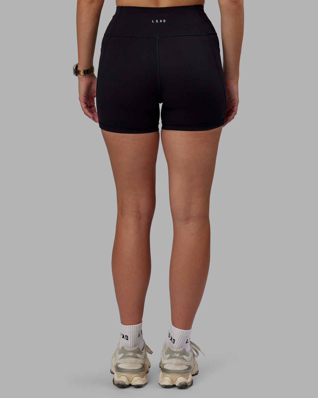 Woman wearing Rep Ultra High-Rise 4" Short Pockets - Black-Black | Model:Lillie | Size:S - view 4