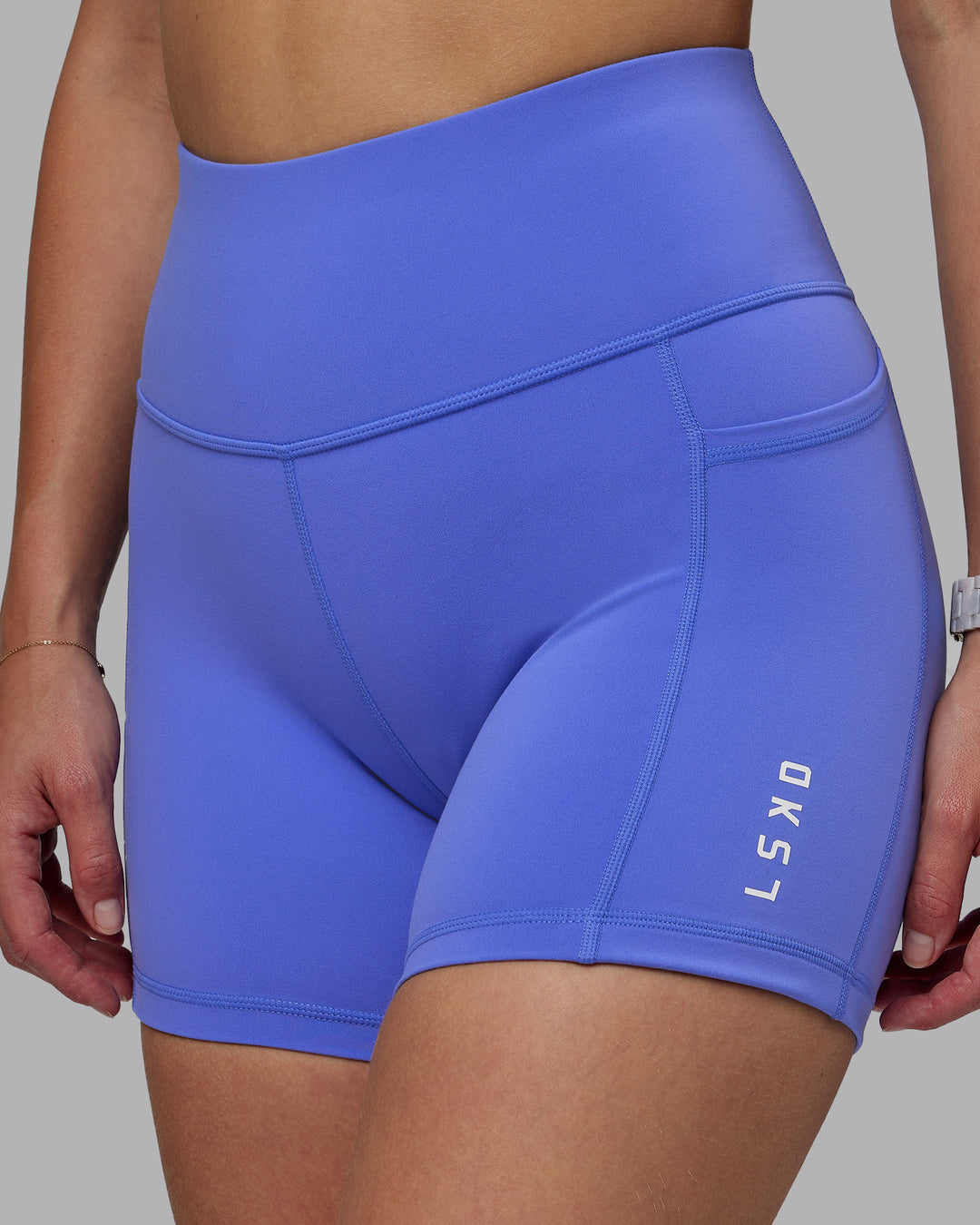 Woman wearing Rep Ultra High-Rise 4" Short Pockets - Baja Blue-White | Model:Lillie | Size:S - view 3