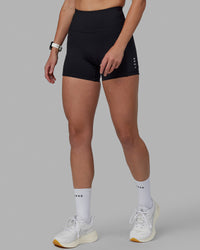 Women wearing O.G. Rep Ultra High-Rise 4" Short Pockets - Black-White | Model:Shae | Size:S | Thumbnail Index: 1