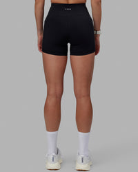 Women wearing O.G. Rep Ultra High-Rise 4" Short Pockets - Black-White | Model:Shae | Size:S | Thumbnail Index: 3