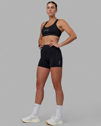 Women wearing O.G. Rep Ultra High-Rise 4" Short Pockets - Black-White | Model:Shae | Size:S | Thumbnail Index: 5