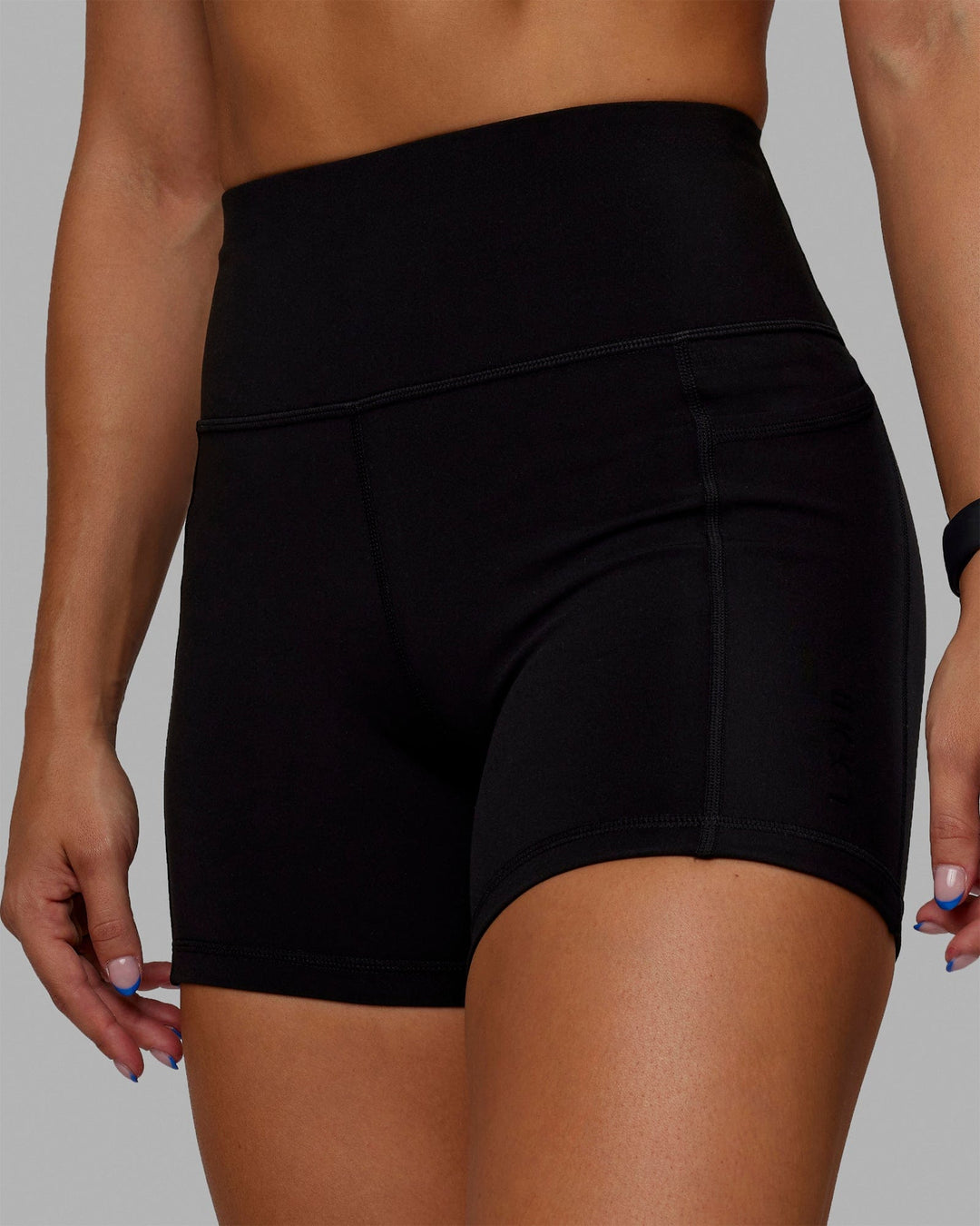 Woman wearing O.G. Rep Ultra High-Rise 4" Short Pockets - Black-Black | Model:Abbey| Size:S - view 4