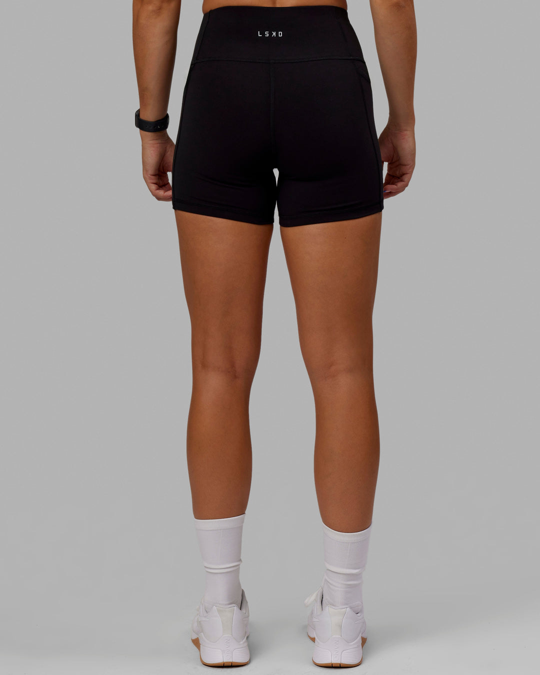 Woman wearing O.G. Rep Ultra High-Rise 4" Short Pockets - Black-Black | Model:Abbey| Size:S - view 6