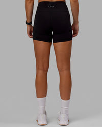 Woman wearing O.G. Rep Ultra High-Rise 4" Short Pockets - Black-Black | Model:Abbey| Size:S | Thumbnail Index: 5