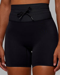 Woman wearing Resistance Ultra High-Rise 6" Short - Black | Thumbnail Index: 0