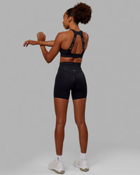 Woman wearing Resistance Ultra High-Rise 6" Short - Black | Thumbnail Index: 3