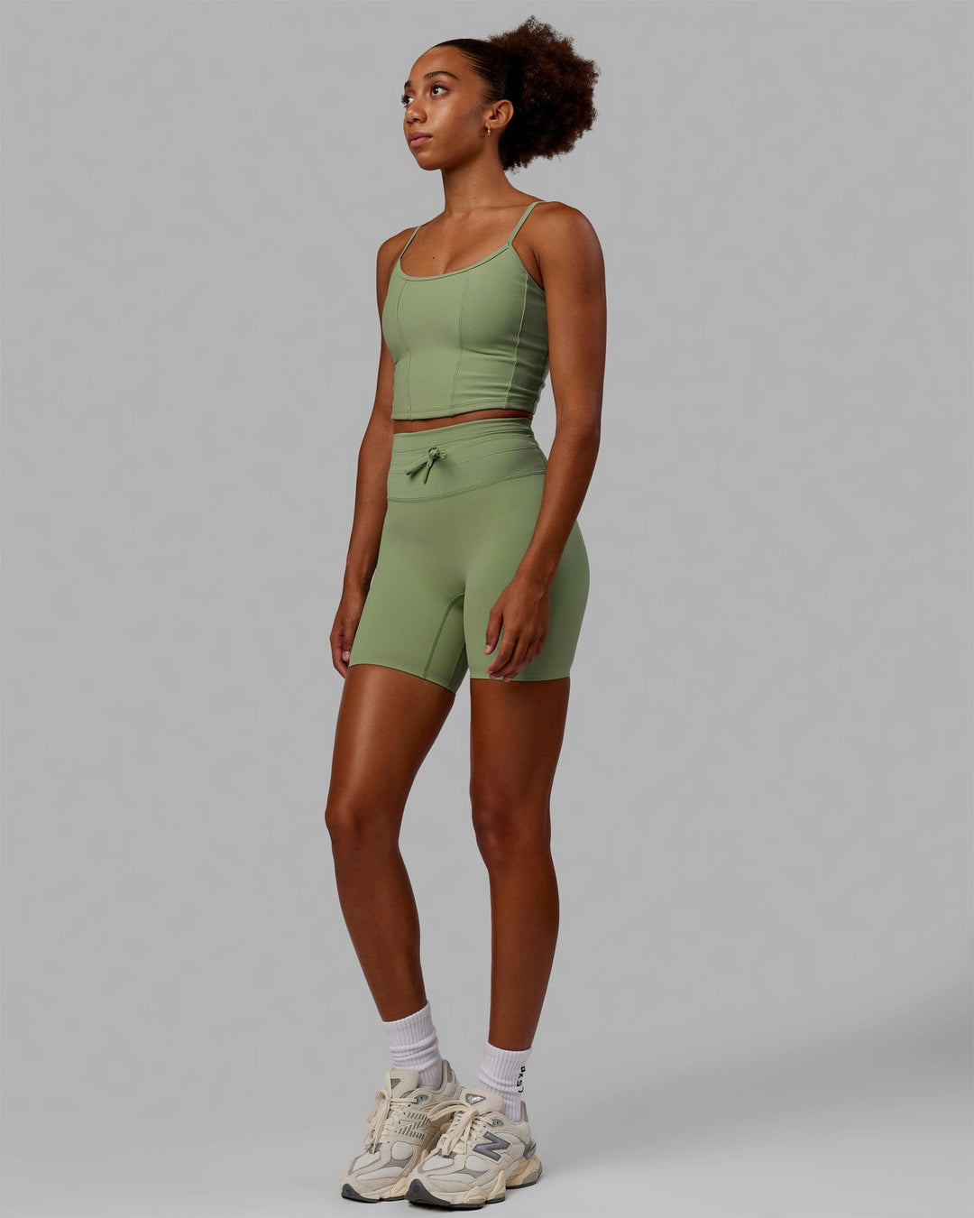 Woman wearing Resistance Ribbed Shelf Bra Performance Tank - Bayleaf - view 3