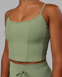 Woman wearing Resistance Ribbed Shelf Bra Performance Tank - Bayleaf | Thumbnail Index: 3