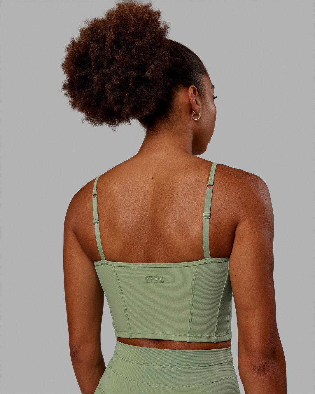 Woman wearing Resistance Ribbed Shelf Bra Performance Tank - Bayleaf - view 5