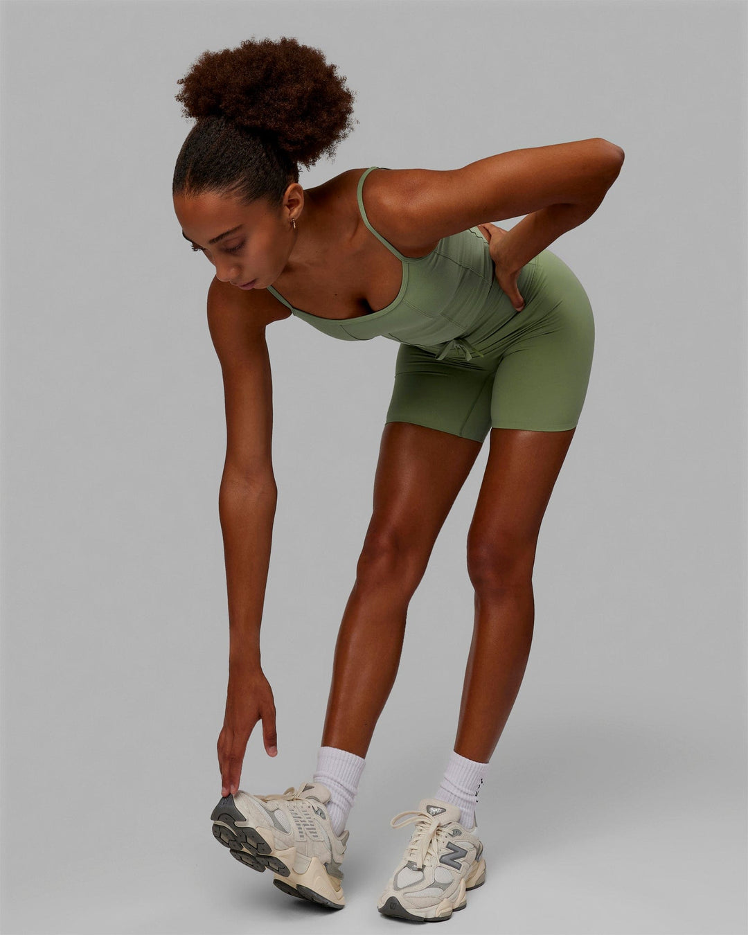Woman wearing Resistance Ribbed Shelf Bra Performance Tank - Bayleaf - view 6