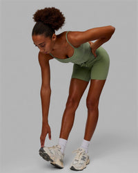 Woman wearing Resistance Ribbed Shelf Bra Performance Tank - Bayleaf | Thumbnail Index: 5