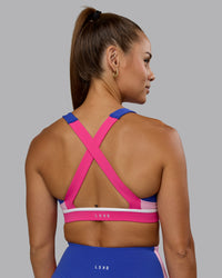 Woman wearing Revitalise Sports Bra - Power Cobalt-Fuchsia Pink | Thumbnail Index: 5