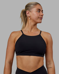 Woman wearing Sara Ares High Neck Sports Bra - Black | Thumbnail Index: 2