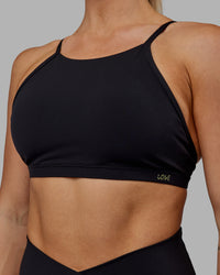 Woman wearing Sara Ares High Neck Sports Bra - Black | Thumbnail Index: 6
