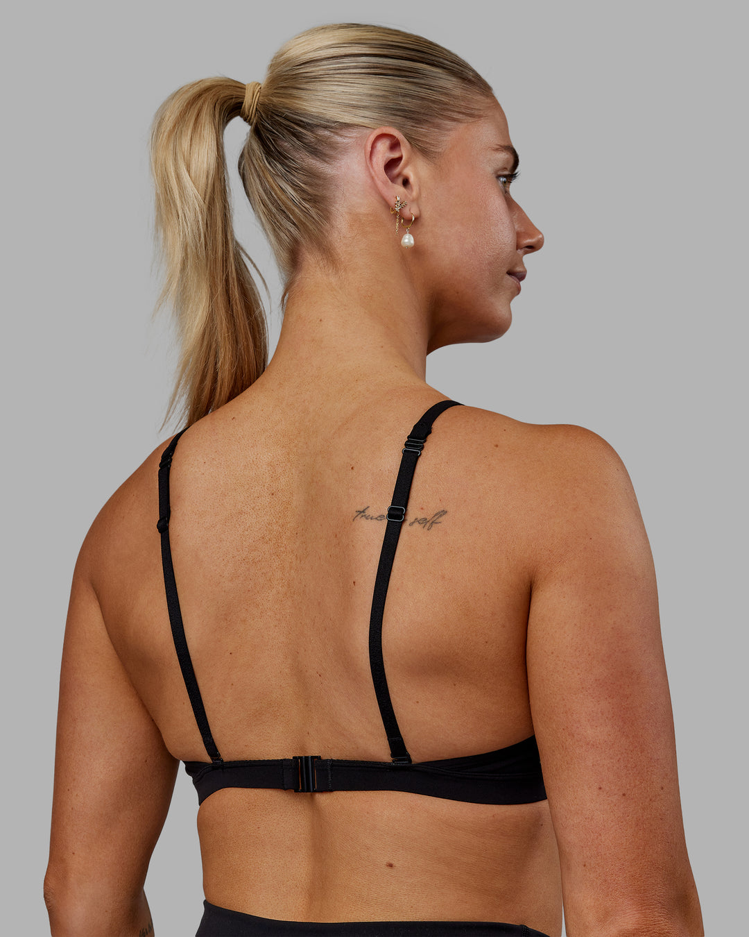 Woman wearing Sara Ares High Neck Sports Bra - Black - view 6