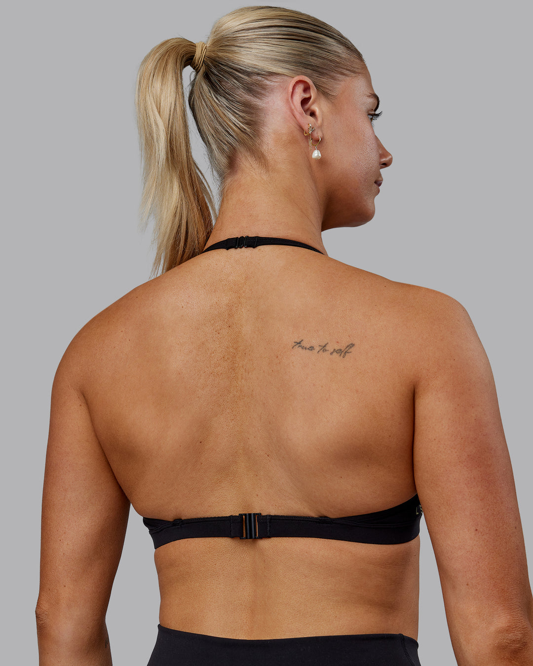 Woman wearing Sara Ares High Neck Sports Bra - Black - view 10