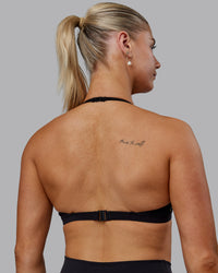 Woman wearing Sara Ares High Neck Sports Bra - Black | Thumbnail Index: 9