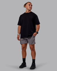 Man wearing Sara GET ÆTLA SKAL Unisex FLXCotton Tee Oversize - Black-White | Thumbnail Index: 5