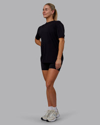 Woman wearing Sara GET ÆTLA SKAL Unisex FLXCotton Tee Oversize - Black-White | Thumbnail Index: 4