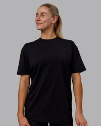 Woman wearing Sara GET ÆTLA SKAL Unisex FLXCotton Tee Oversize - Black-White | Thumbnail Index: 2