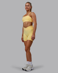 Woman wearing Sara Helios Sports Bra - Sunflower | Thumbnail Index: 5