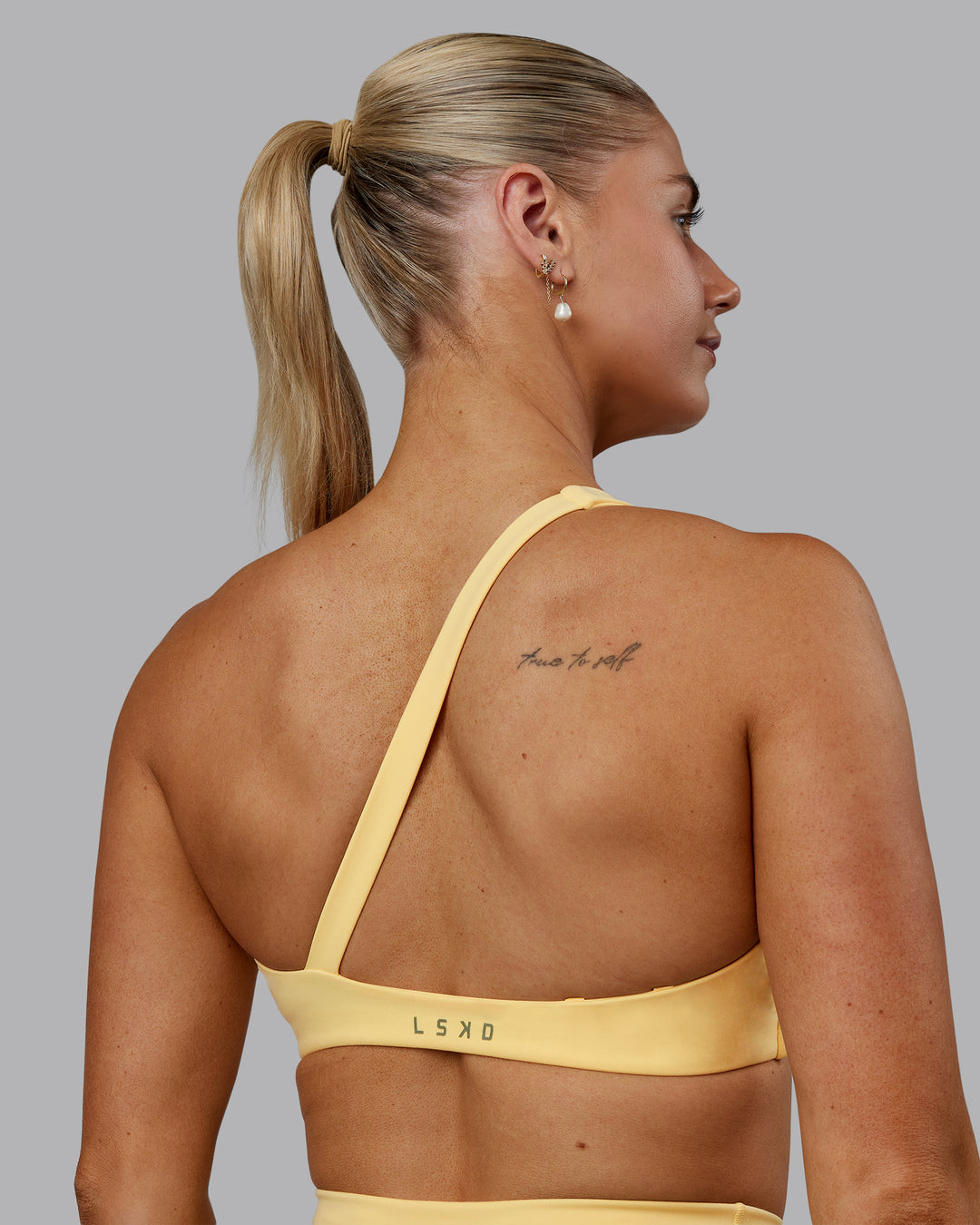 Woman wearing Sara Helios Sports Bra - Sunflower - view 11