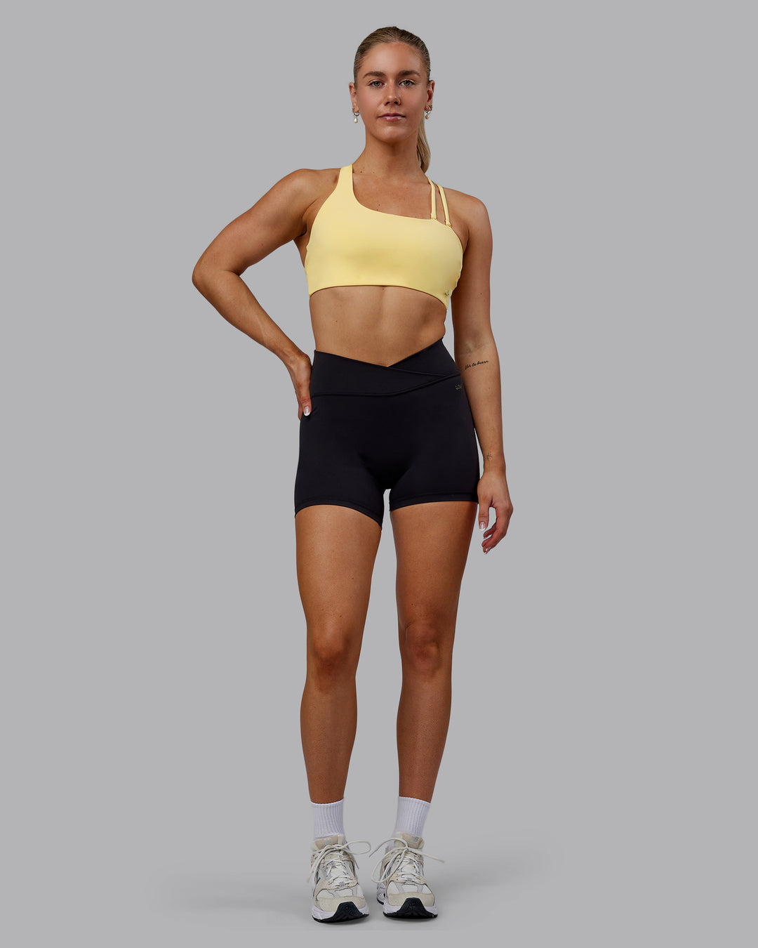 Woman wearing Sara Helios Sports Bra - Sunflower - view 12